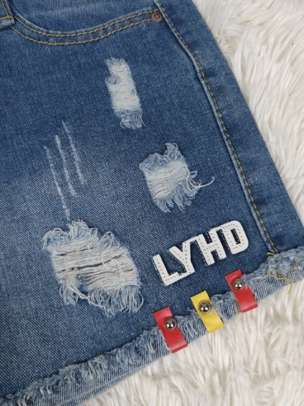 Distressed Denim Cutoff Shorts with Embellishment